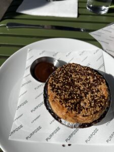 curry pie served on a plate with tomato sauce