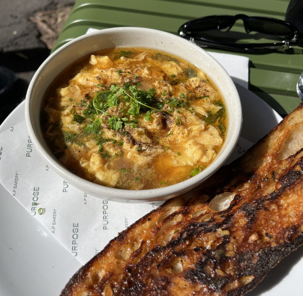 egg soup served with coriander and a big toasted baguette