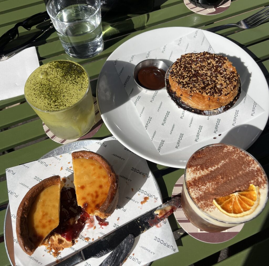 a table full of sweets like the flan pastry, morning coffee including the mont blac, and the fresh curry pie