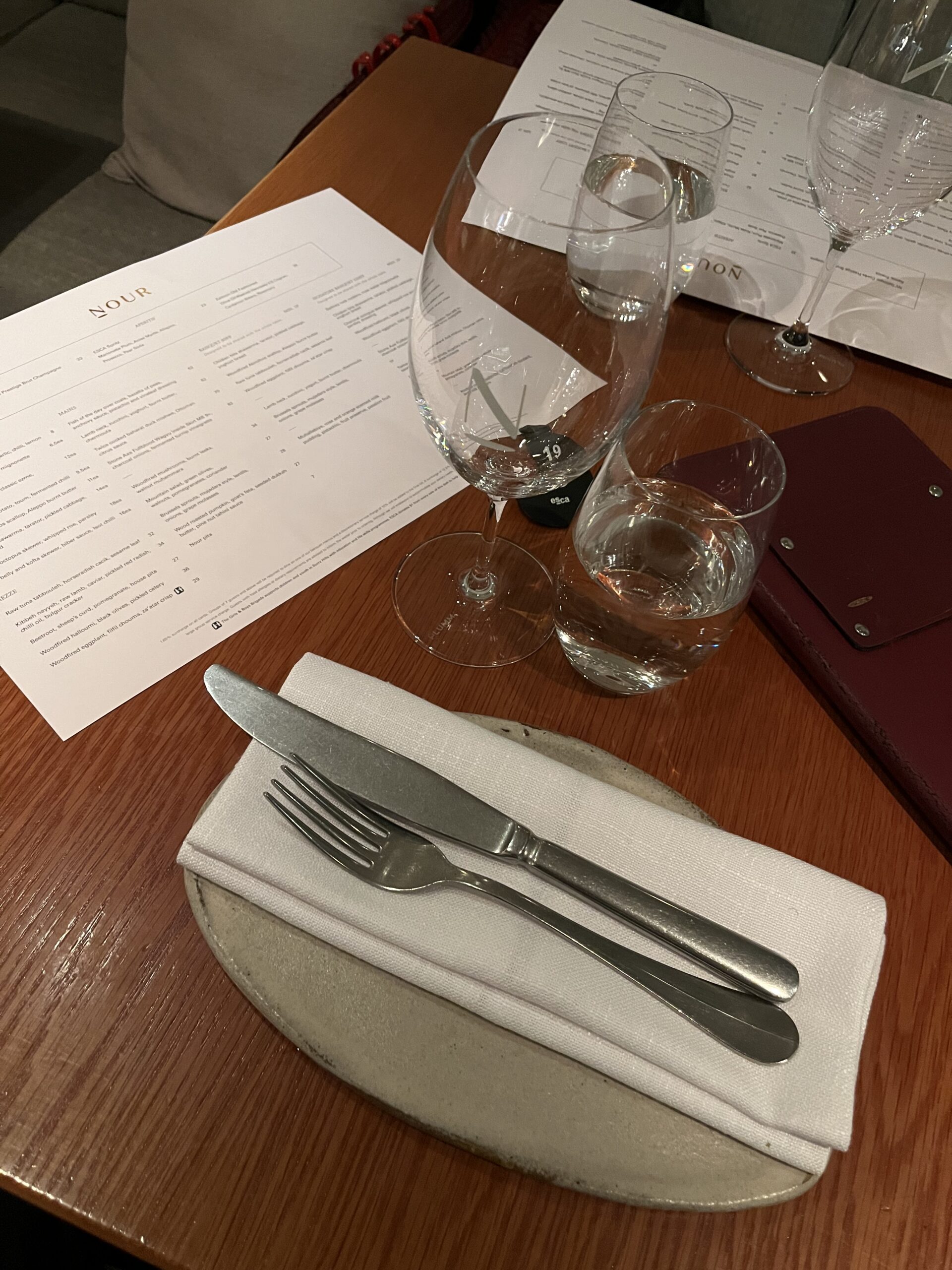 tabletop at nour with basic and clean tableware with a cool plate