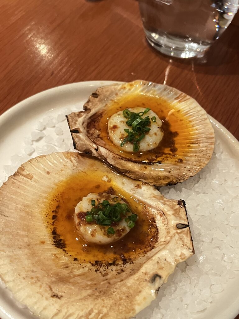 woodfired scallops served in shell with green sauce